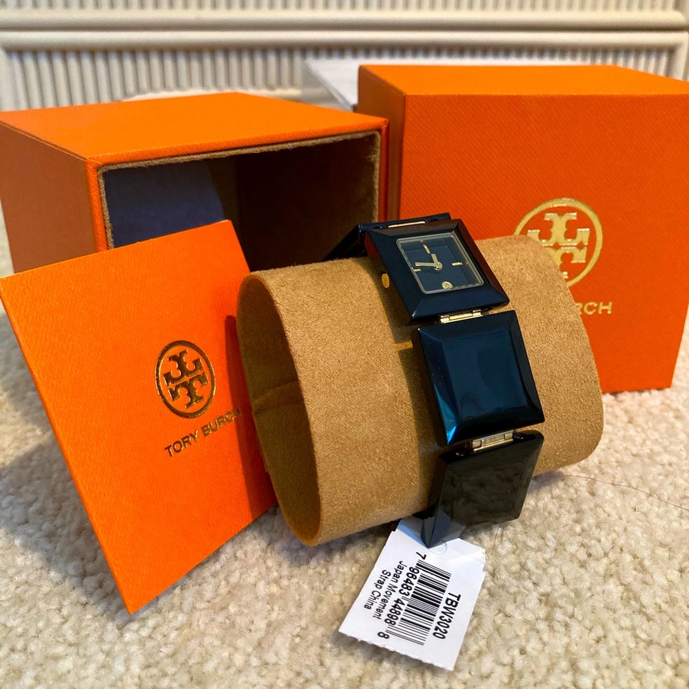 Tory Burch black square acetate watch with gold detail.